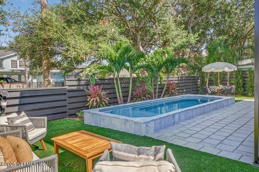 Exterior details and patio area of a home in , Neptune Beach (Image 51).