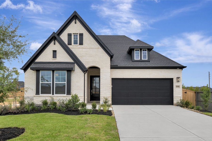 Front exterior of a new home in The Grand Prairie - Retreat Collection, Hockley, TX, highlighting curb appeal (Image 1). Front exterior of a new home in The Grand Prairie - Retreat Collection, Hockley, TX, highlighting curb appeal (Image 1).