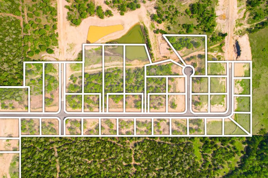 Visualize this community's design, featuring numerous residential lots surrounding serene ponds.