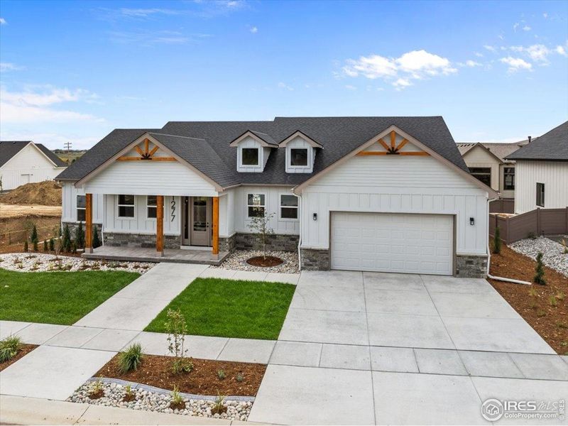 Front exterior of a new home in , Berthoud, CO, highlighting curb appeal (Image 28).