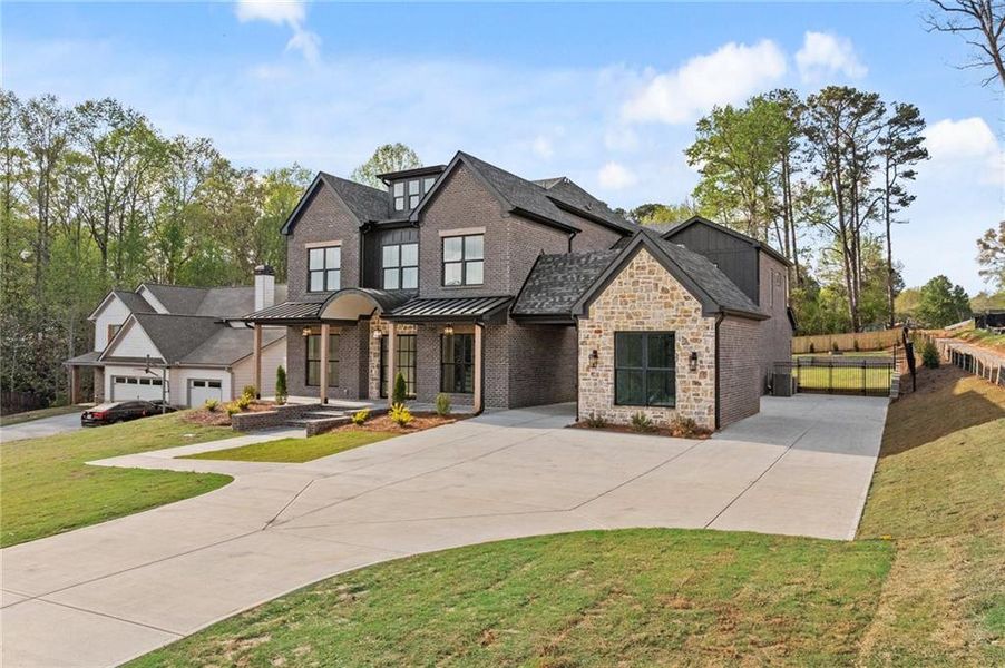 Front exterior of a new home in , Dacula, GA, highlighting curb appeal (Image 1). Front exterior of a new home in , Dacula, GA, highlighting curb appeal (Image 1).