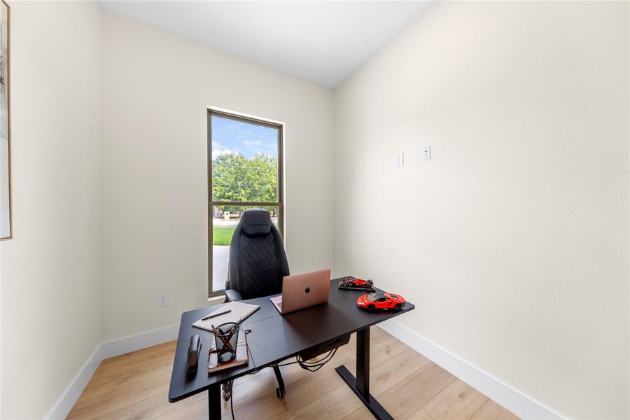 Office with light wood finished floors Office with light wood finished floors