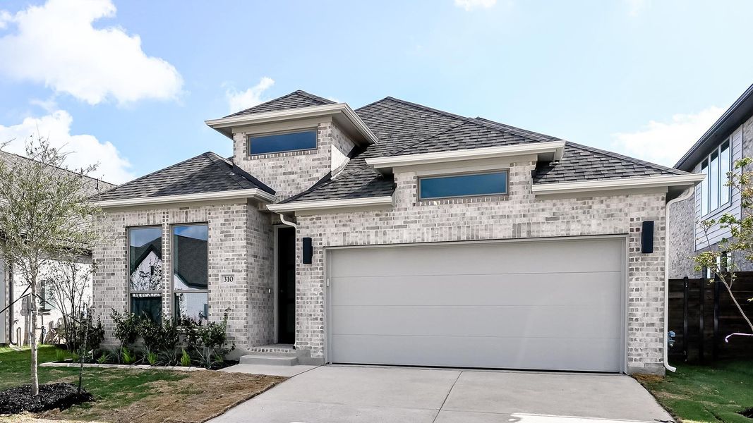 Front exterior of a new home in Juniper Springs, Lockhart, TX, highlighting curb appeal (Image 2). Front exterior of a new home in Juniper Springs, Lockhart, TX, highlighting curb appeal (Image 2).