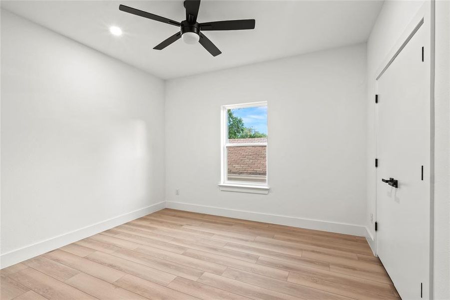 Unfurnished bedroom with light wood-type flooring, baseboards, a closet, recessed lighting, and a ceiling fan Unfurnished bedroom with light wood-type flooring, baseboards, a closet, recessed lighting, and a ceiling fan