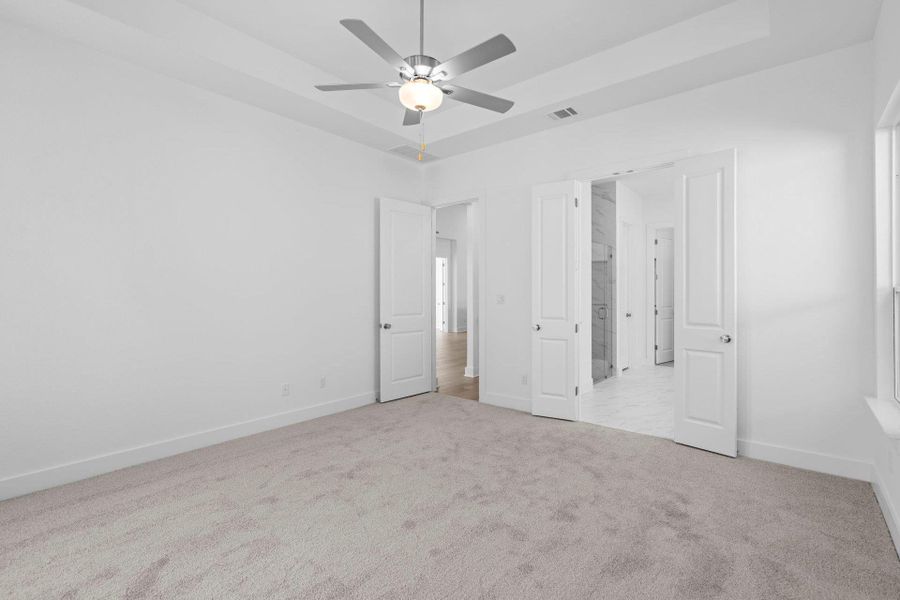 Primary Bedroom with tray ceiling Primary Bedroom with tray ceiling