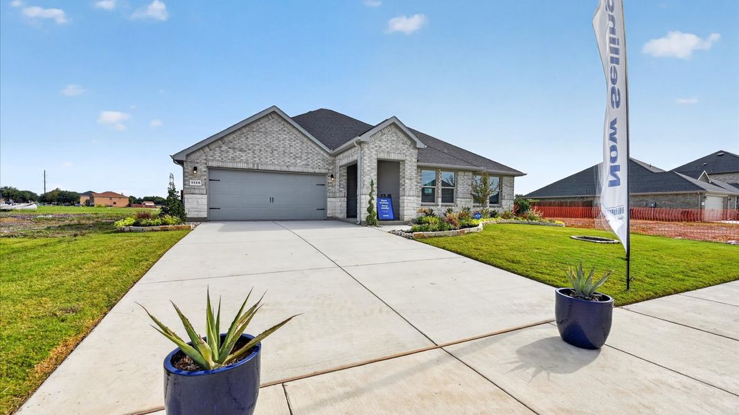 Representative exterior photo of a completed home built from the Dillon by D.R. Horton in Parkerville Meadows, DeSoto, TX (Image 2).