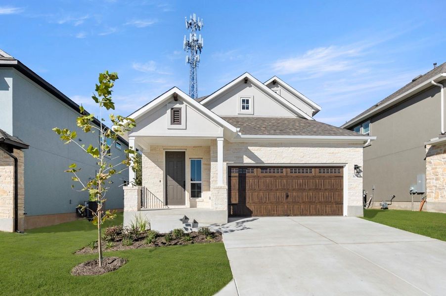 Front exterior of a new home in Clear Creek, Round Rock, TX, highlighting curb appeal (Image 24).