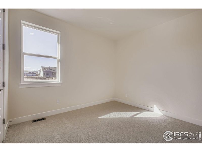 Spacious, unfurnished interior of a new home in RainDance National 60/70, Windsor (Image 17).