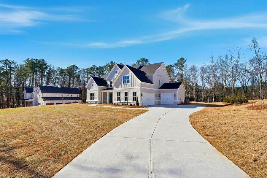 Front exterior of a new home in , Marietta, GA, highlighting curb appeal (Image 24).