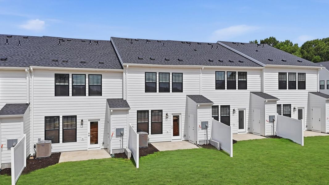 Refined rear exterior with a stylish and private backyard for dining, relaxing, or entertaining near Downtown Simpsonville