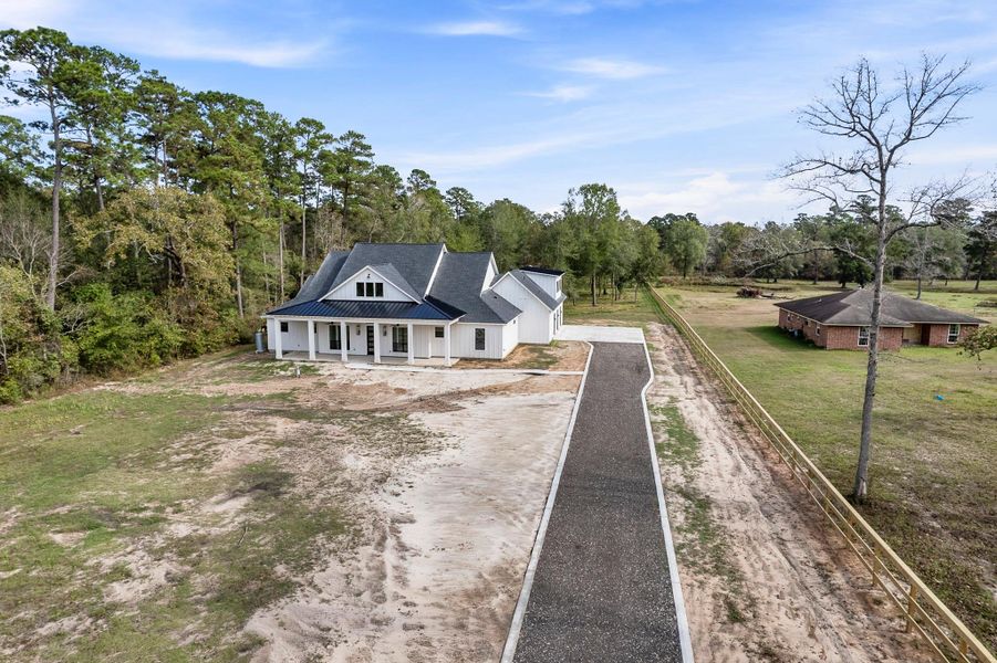 Front exterior of a new home in , Magnolia, TX, highlighting curb appeal (Image 28). Front exterior of a new home in , Magnolia, TX, highlighting curb appeal (Image 28).