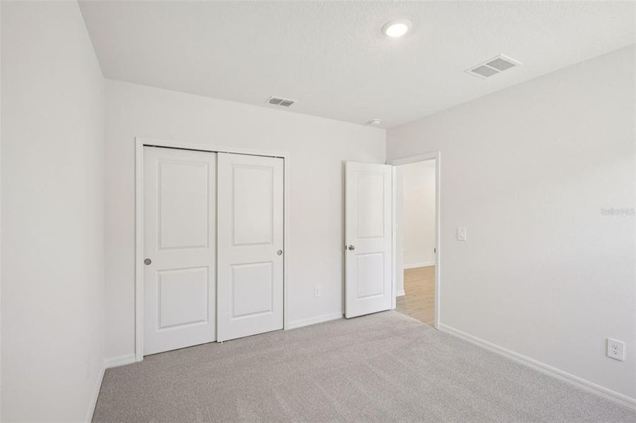 Spacious, unfurnished interior of a new home in The Grove at Stuart Crossing - Classic Series, Bartow (Image 32).