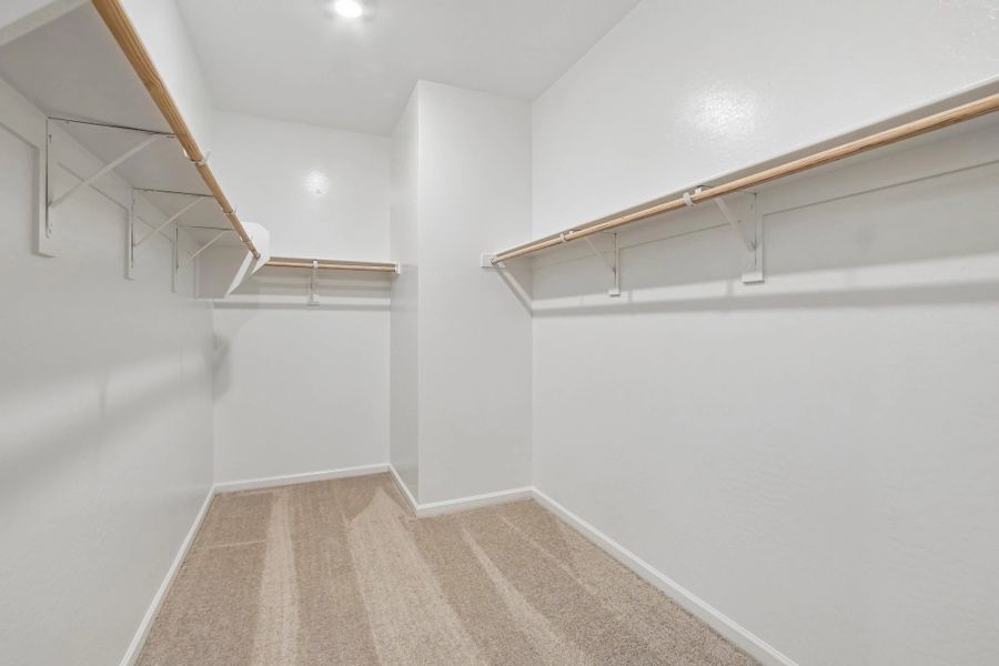 Primary walk in closet Primary walk in closet
