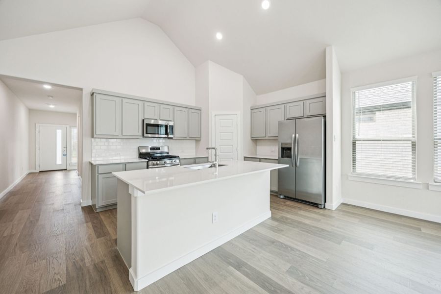 Kitchen in the Claret home plan by Trophy Signature Homes – REPRESENTATIVE PHOTO Kitchen in the Claret home plan by Trophy Signature Homes – REPRESENTATIVE PHOTO
