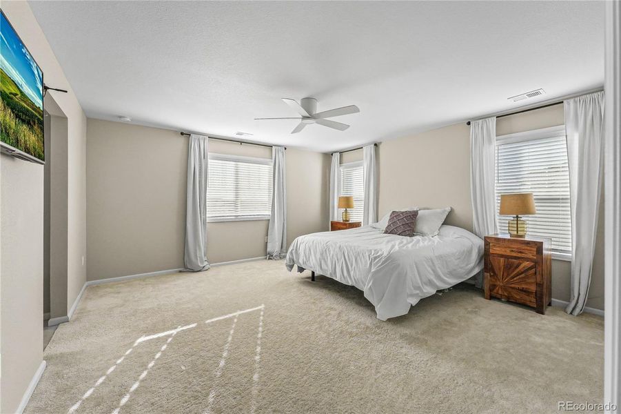 Primary Bedroom: Generous suite with dual closets.