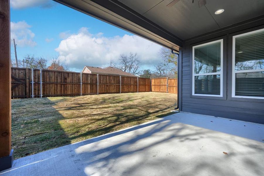 View of yard with a patio area and ceiling fan