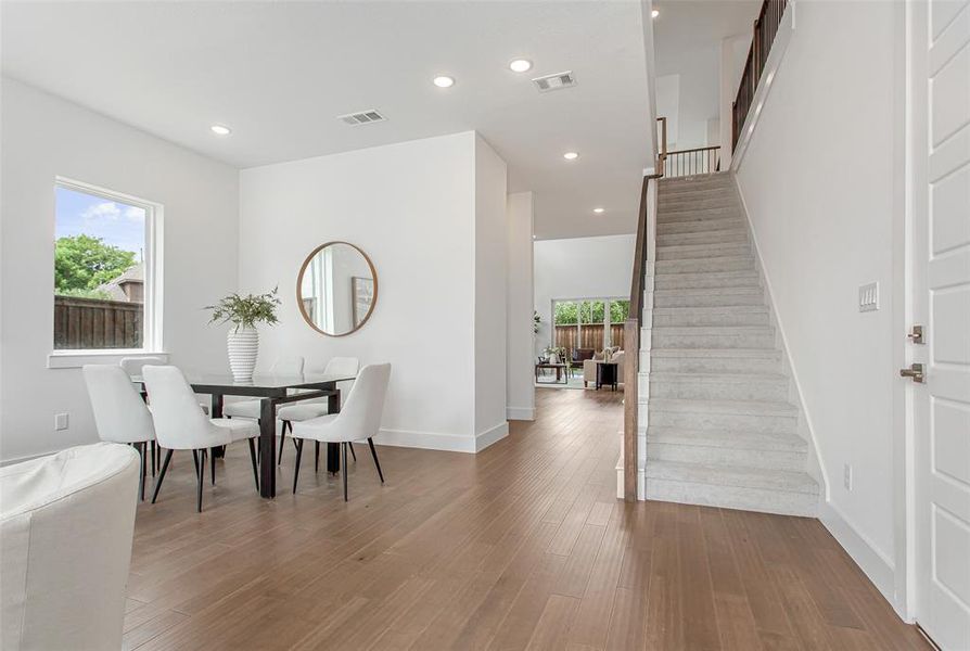 Dining area with wood-type flooring