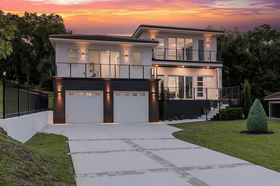 Front exterior of a new home in , Clermont, FL, highlighting curb appeal (Image 31). Front exterior of a new home in , Clermont, FL, highlighting curb appeal (Image 31).