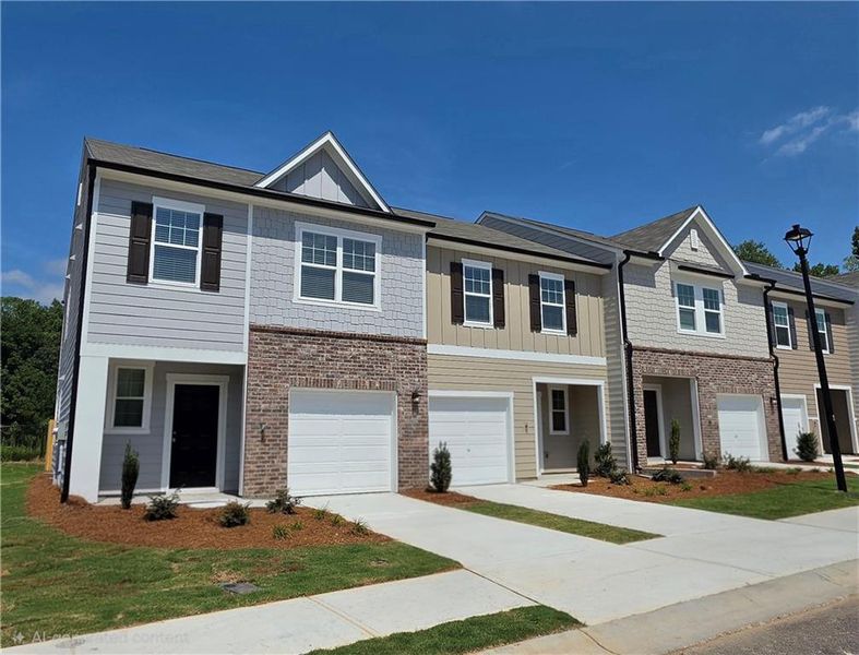 Front exterior of a new home in Kingston Cove, Auburn, GA, highlighting curb appeal (Image 1). Front exterior of a new home in Kingston Cove, Auburn, GA, highlighting curb appeal (Image 1).