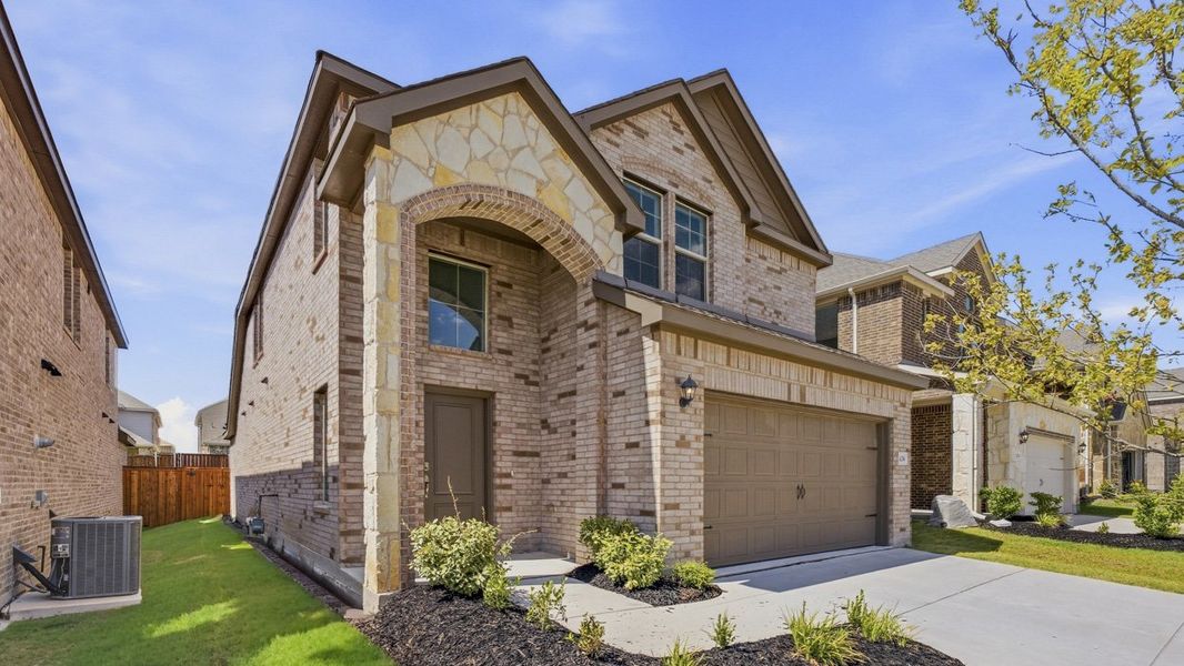 Front exterior of a new home in Bel Air Village, Sherman, TX, highlighting curb appeal (Image 2). Front exterior of a new home in Bel Air Village, Sherman, TX, highlighting curb appeal (Image 2).
