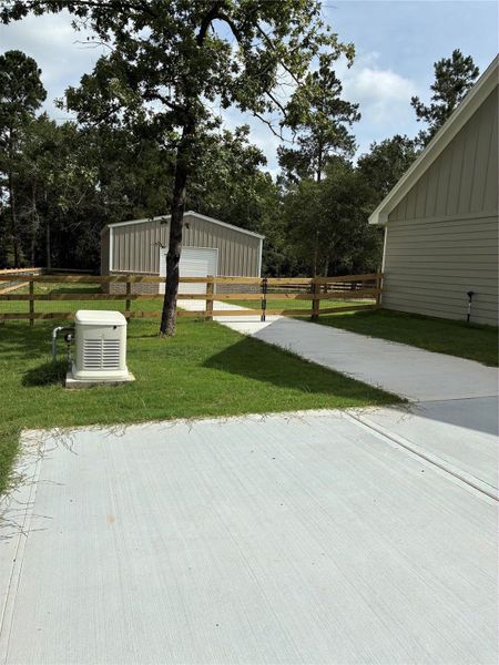 Exterior details and patio area of a home in , New Waverly (Image 20).