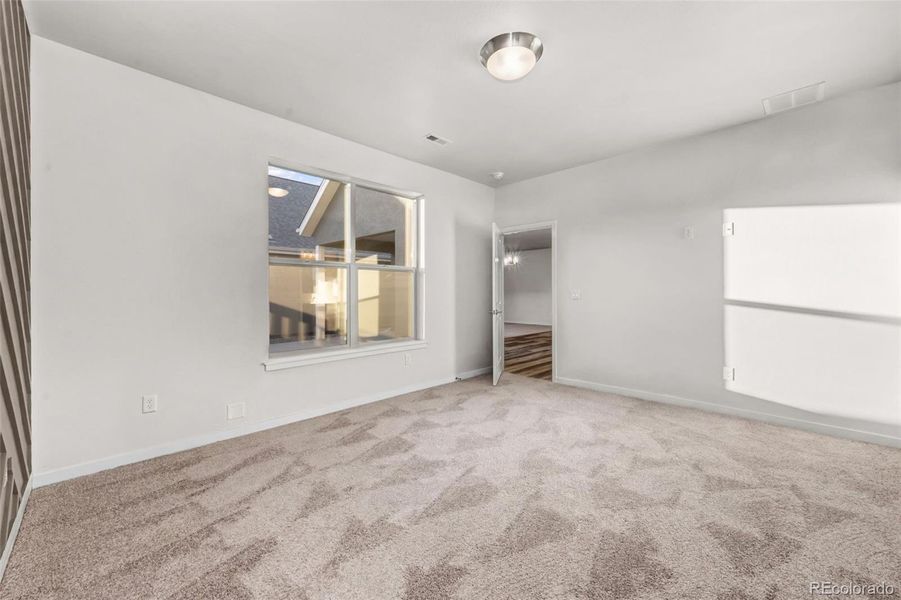 Spacious, unfurnished interior of a new home in The Courtyards at Lupton Village, Fort Lupton (Image 15).