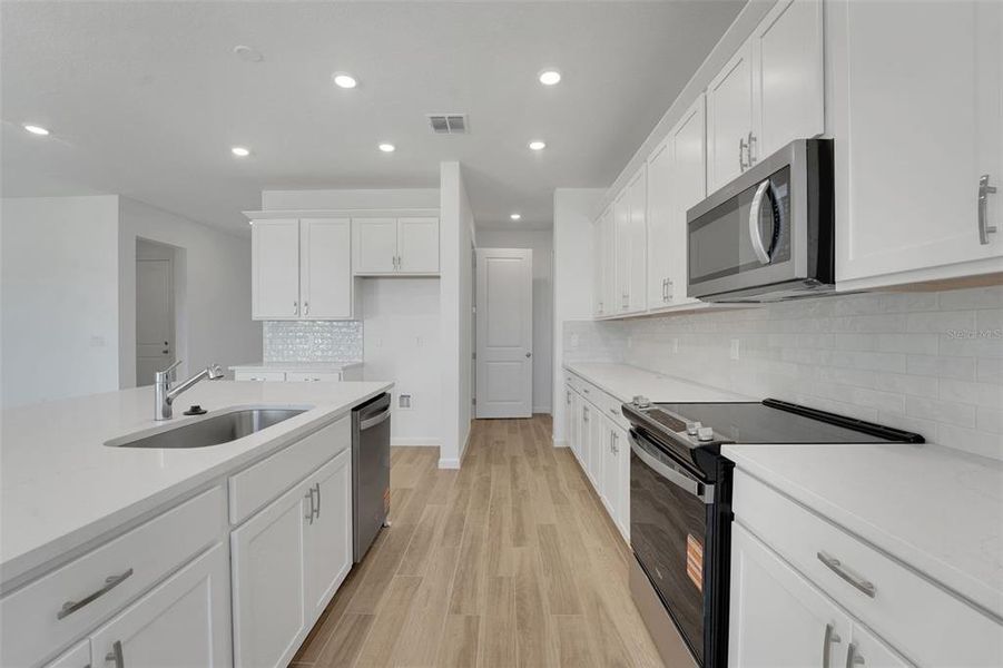 Furnished interior view inside a new home in Green Key Village, Lady Lake (Image 11).