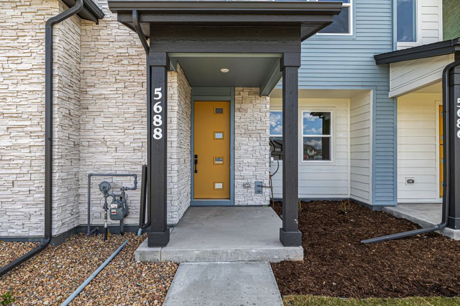 Front exterior of a new home in Painted Prairie, Aurora, CO, highlighting curb appeal (Image 24).