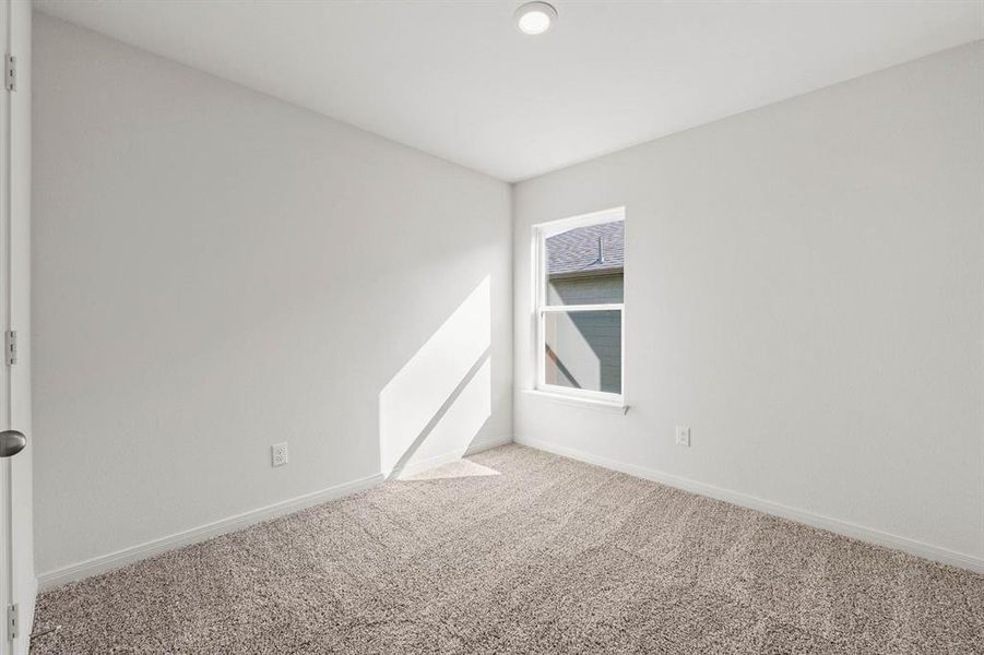 Unfurnished room featuring carpet flooring