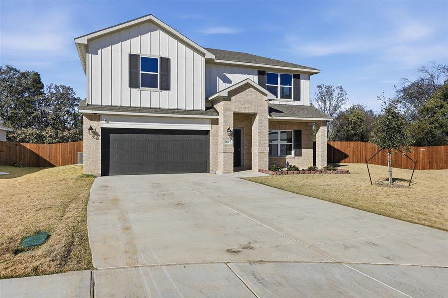 Front exterior of a new home in Courtland Place, Cleburne, TX, highlighting curb appeal (Image 2). Front exterior of a new home in Courtland Place, Cleburne, TX, highlighting curb appeal (Image 2).