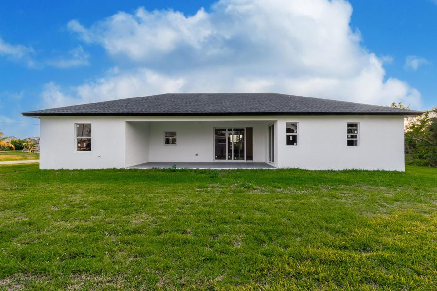 Front exterior of a new home in , Port Charlotte, FL, highlighting curb appeal (Image 15). Front exterior of a new home in , Port Charlotte, FL, highlighting curb appeal (Image 15).