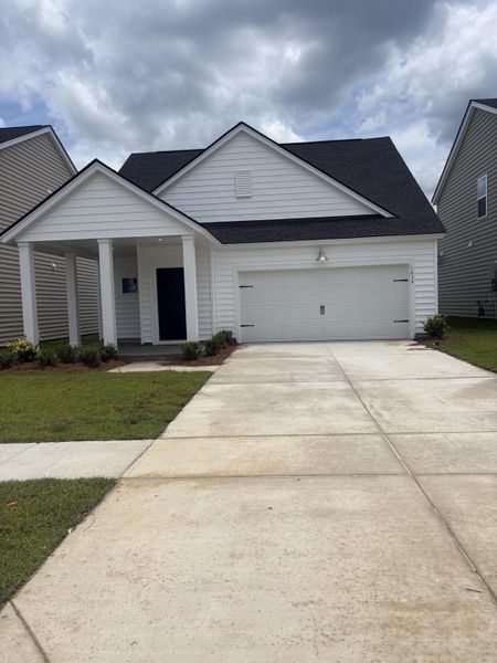 Front exterior of a new home in Sweetgrass at Summers Corner, Summerville, SC, highlighting curb appeal (Image 1). Front exterior of a new home in Sweetgrass at Summers Corner, Summerville, SC, highlighting curb appeal (Image 1).