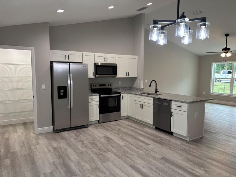 Furnished interior view inside a new home in , Dunnellon (Image 8).
