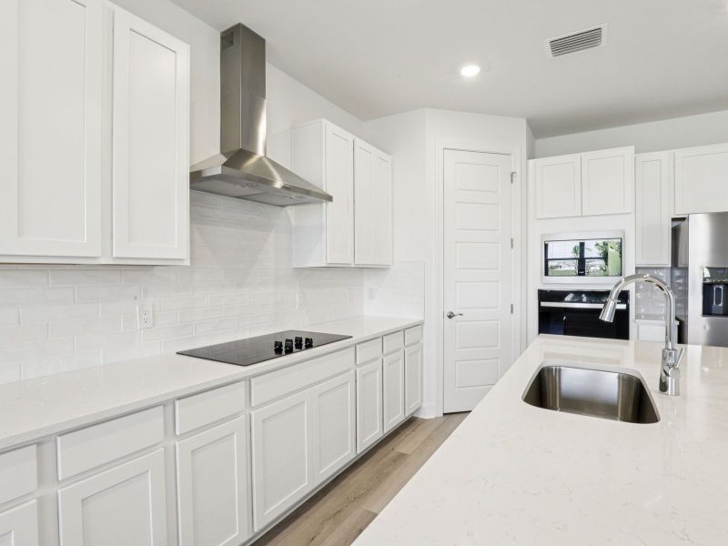 Furnished interior view inside a new home in Crescent Lakes - Signature Series, Punta Gorda (Image 6).