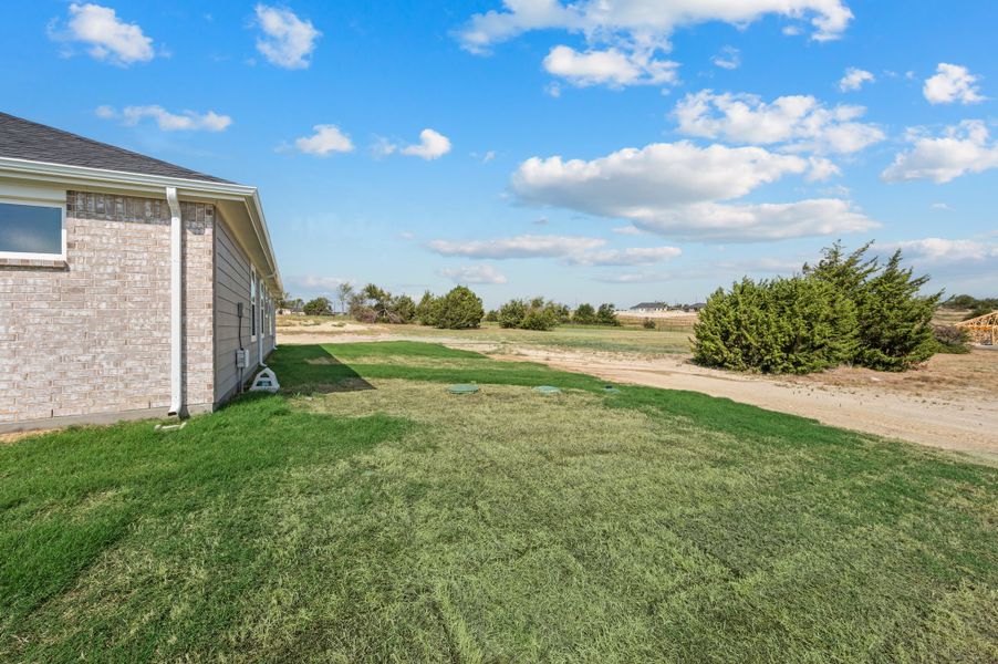 Exterior details and patio area of a home in Gatlin Ranch, Springtown (Image 21).