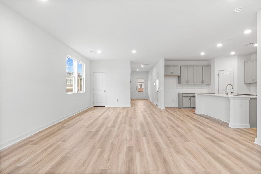 A large kitchen with white cabinets.