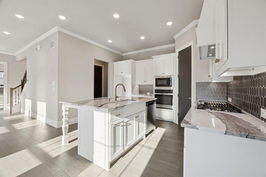 Upgraded countertops with gas cooktop.
