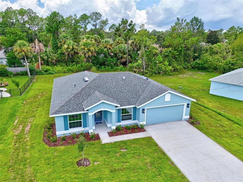 Front exterior of a new home in , Palm Coast, FL, highlighting curb appeal (Image 38).