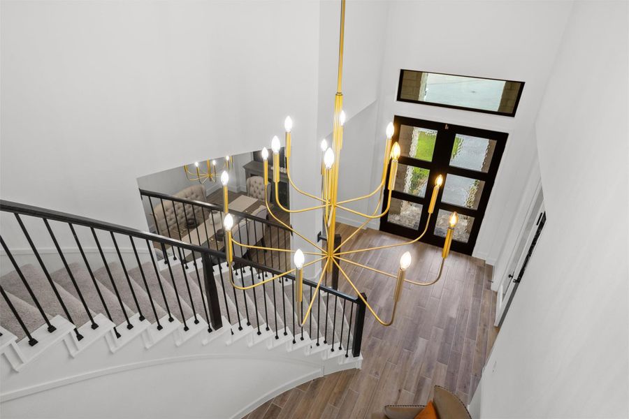 Dramatic staircase and designer chandelier