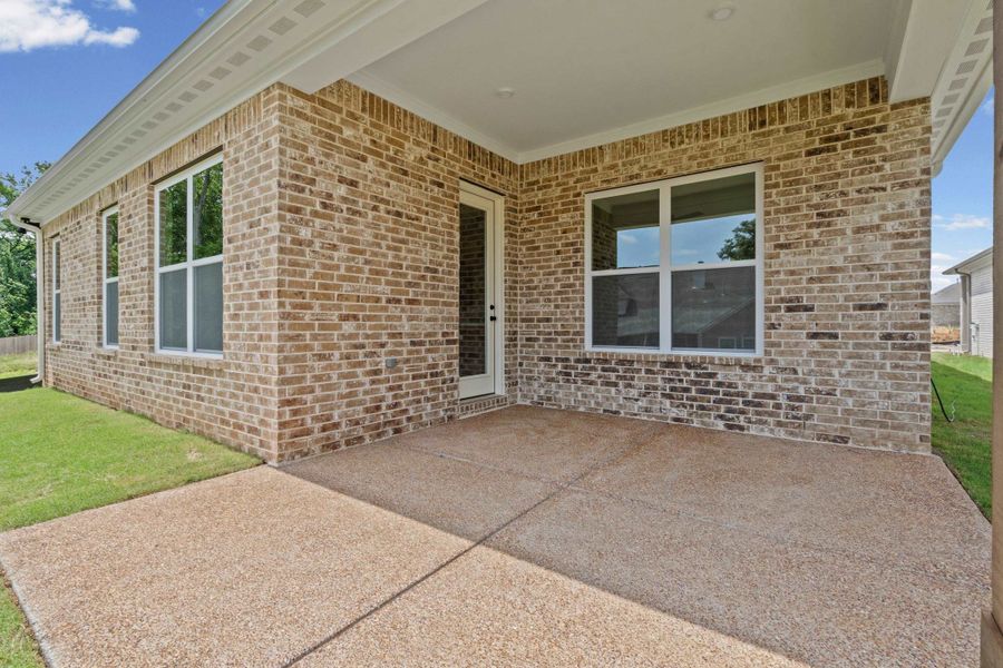 Covered patio featuring an exposed aggregate concrete surface Covered patio featuring an exposed aggregate concrete surface
