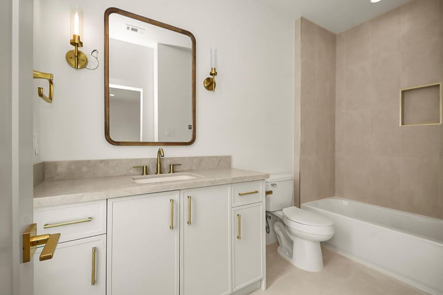 Thoughtfully designed with timeless finishes and functional layouts, the secondary bathrooms provide a polished and cohesive feel throughout the home.