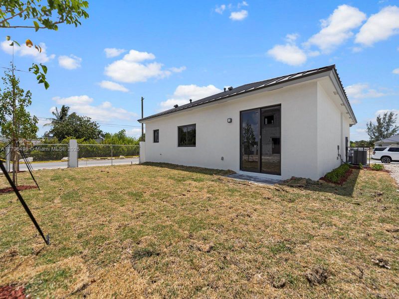 Front exterior of a new home in , Homestead, FL, highlighting curb appeal (Image 16).