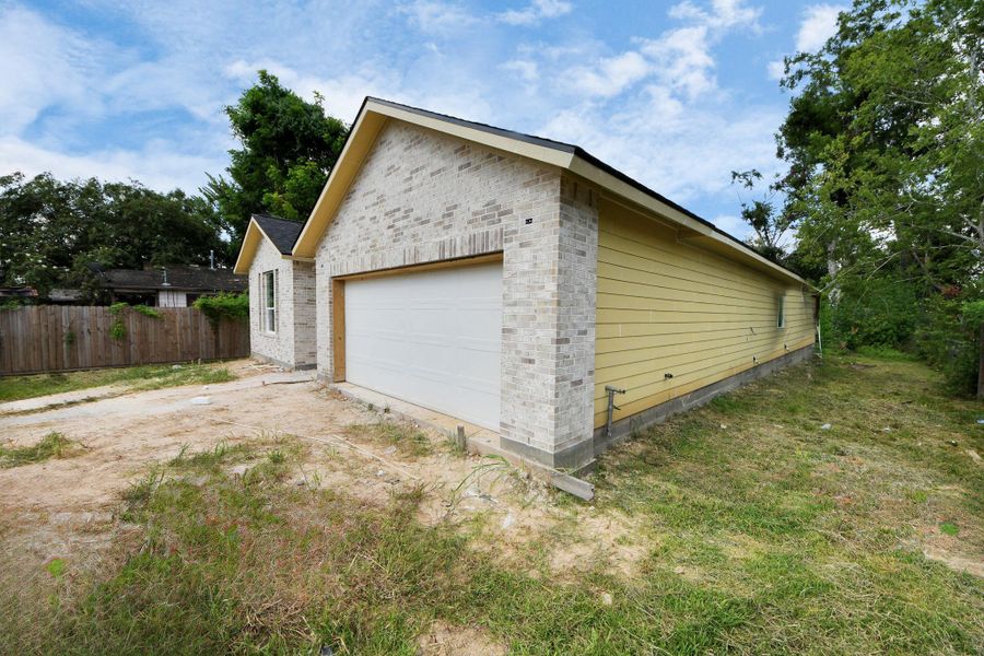 Front exterior of a new home in , Houston, TX, highlighting curb appeal (Image 12).