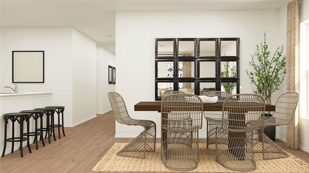 Dining space featuring sink and light wood-type flooring