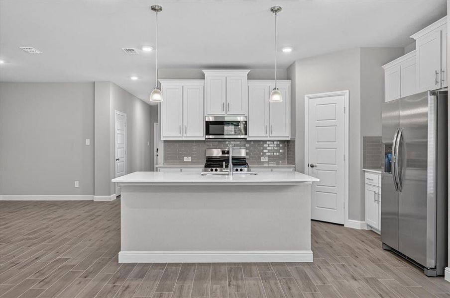 Kitchen- All Home and community information, including pricing, included features, terms, availability and amenities, are subject to change at any time without notice or obligation. All Drawings, pictures, photographs, video, square footages, floor plans, elevations, features, colors and sizes are approximate for illustration purposes only and will vary from the homes as built.