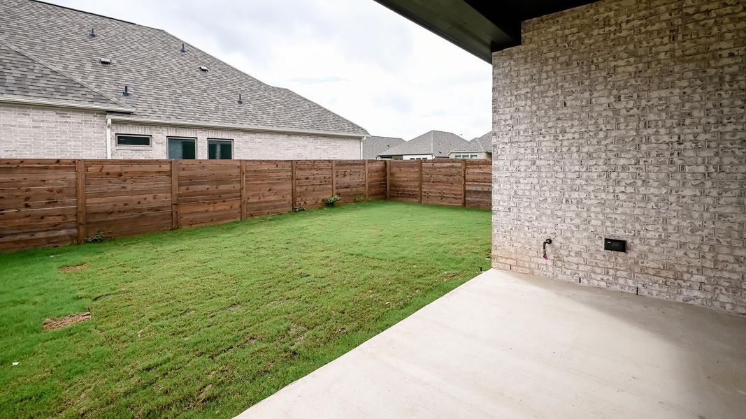 Exterior details and patio area of a home in Juniper Springs, Lockhart (Image 3).