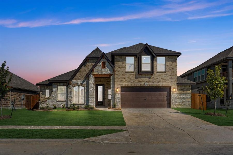 Front exterior of a new home in Maplewood, Glenn Heights, TX, highlighting curb appeal (Image 24). Front exterior of a new home in Maplewood, Glenn Heights, TX, highlighting curb appeal (Image 24).