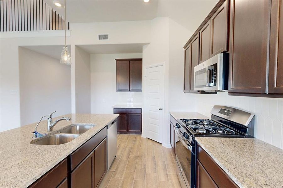Furnished interior view inside a new home in Kings Way, Denton (Image 6).