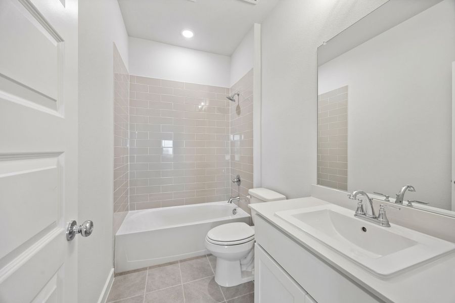 Bathroom in the Wimbledon home plan by Trophy Signature Homes – REPRESENTATIVE PHOTO