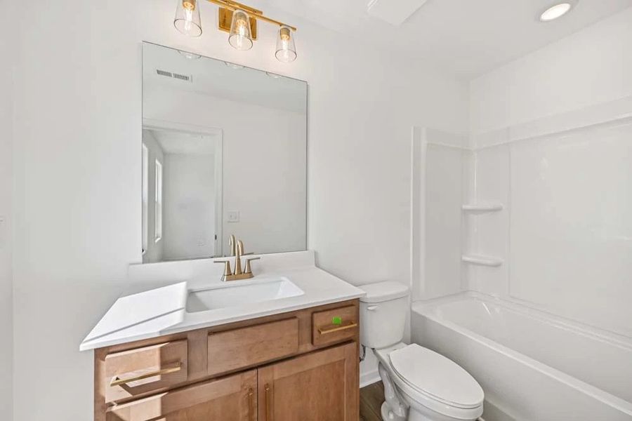 Sample Photo: Bathroom Three featuring Laguna Collection Finishes